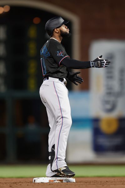 Bryan De La Cruz #14 of the Miami Marlins reacts after hitting a two-run double in the top of the sixth inning against the San Francisco Giants at Oracle Park on May 19, 2023 in San Francisco, California.