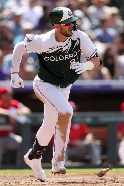 Kris Bryant #23 of the Colorado Rockies hits a 2 RBI single against the Cincinnati Reds in the sixth inning at Coors Field on May 17, 2023 in Denver, Colorado.