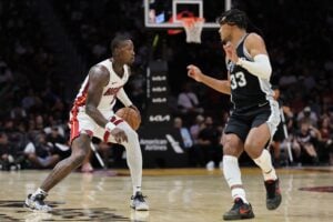 Oct 15, 2024; Miami, Florida, USA; Miami Heat guard Terry Rozier (2) dribbles the basketball as San Antonio Spurs guard Tre Jones (33) defends during the third quarter at Kaseya Center. Mandatory Credit: Sam Navarro-Imagn Images